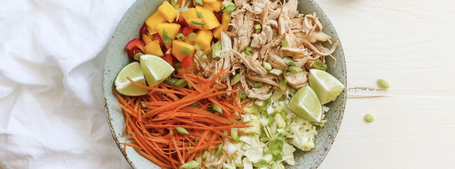 thai chopped chicken salad with peanut sauce, carrots, lime
